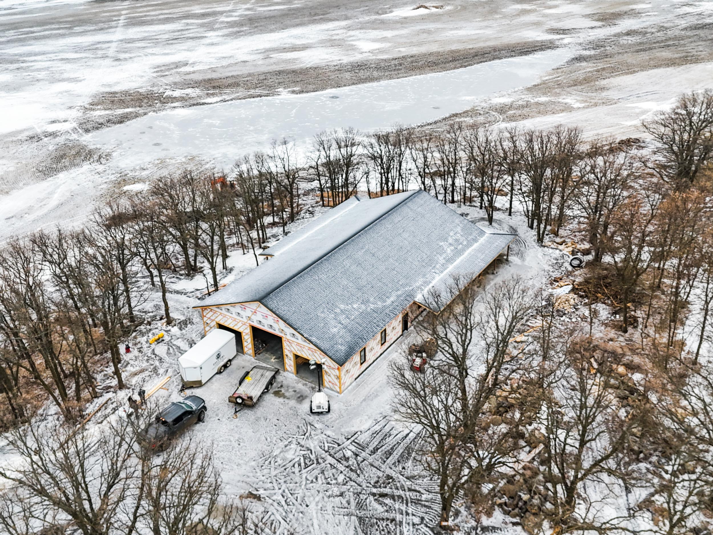 House shell construction with framing, roof, windows and exterior envelope completed by Grey Owl Construction near St. Léon, Manitoba.